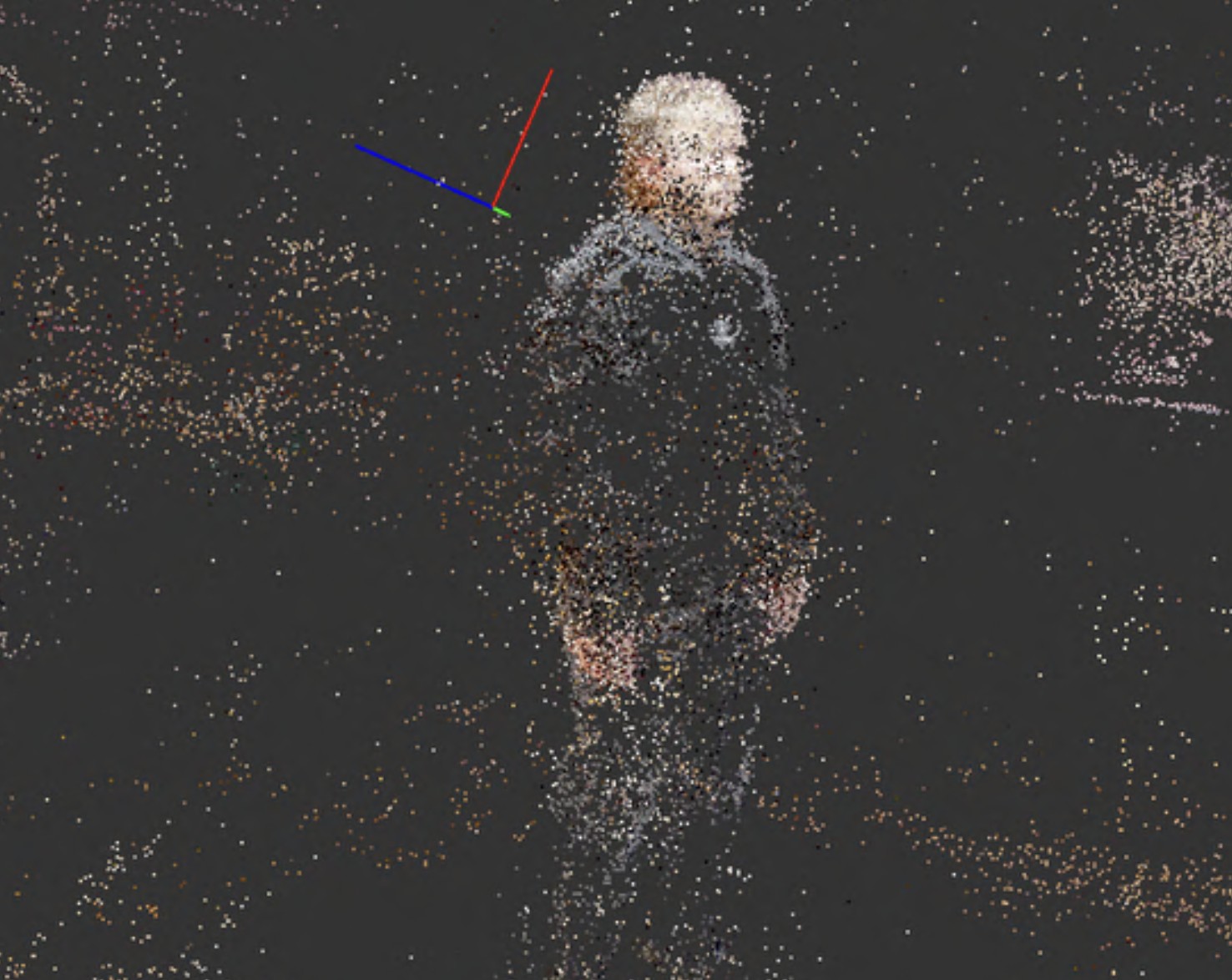 A person captured as a colourful point cloud during 3D scanning