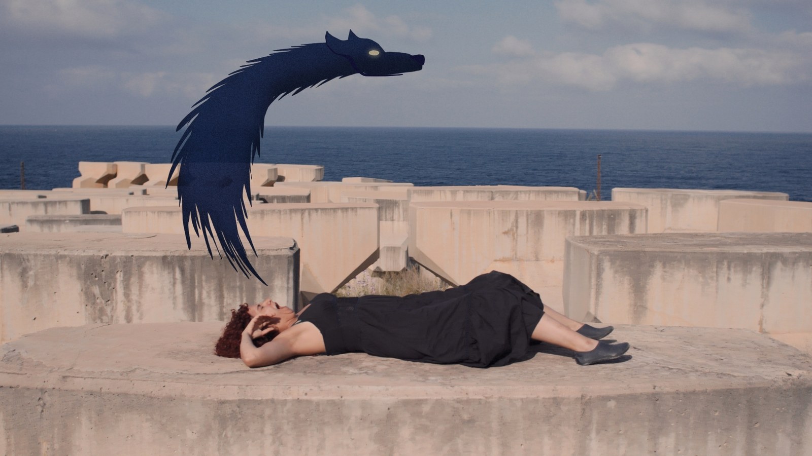A woman lies on a concrete breakwater while an animated dark blue wolf rears over her